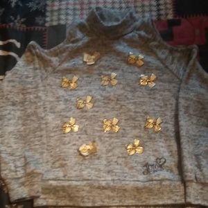 Girls long sleeve shirt with shoulder cut out.